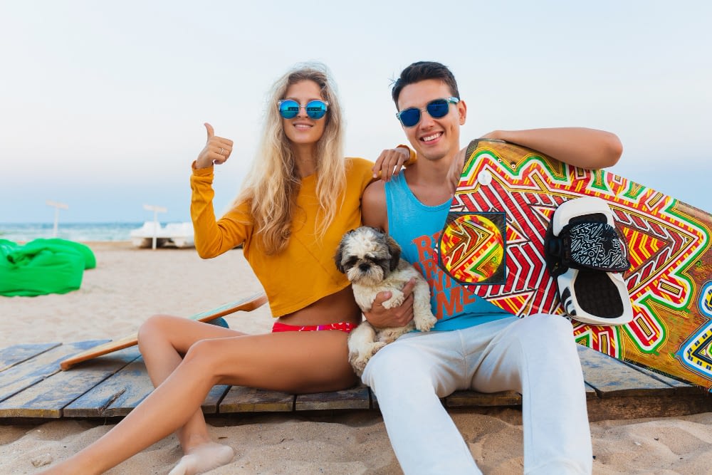 young-smiling-couple-having-fun-beach-with-kite-surfing-board-summer-vacation Young Smiling Couple Having Fun Beach With Kite Surfing Board Summer Vacation
